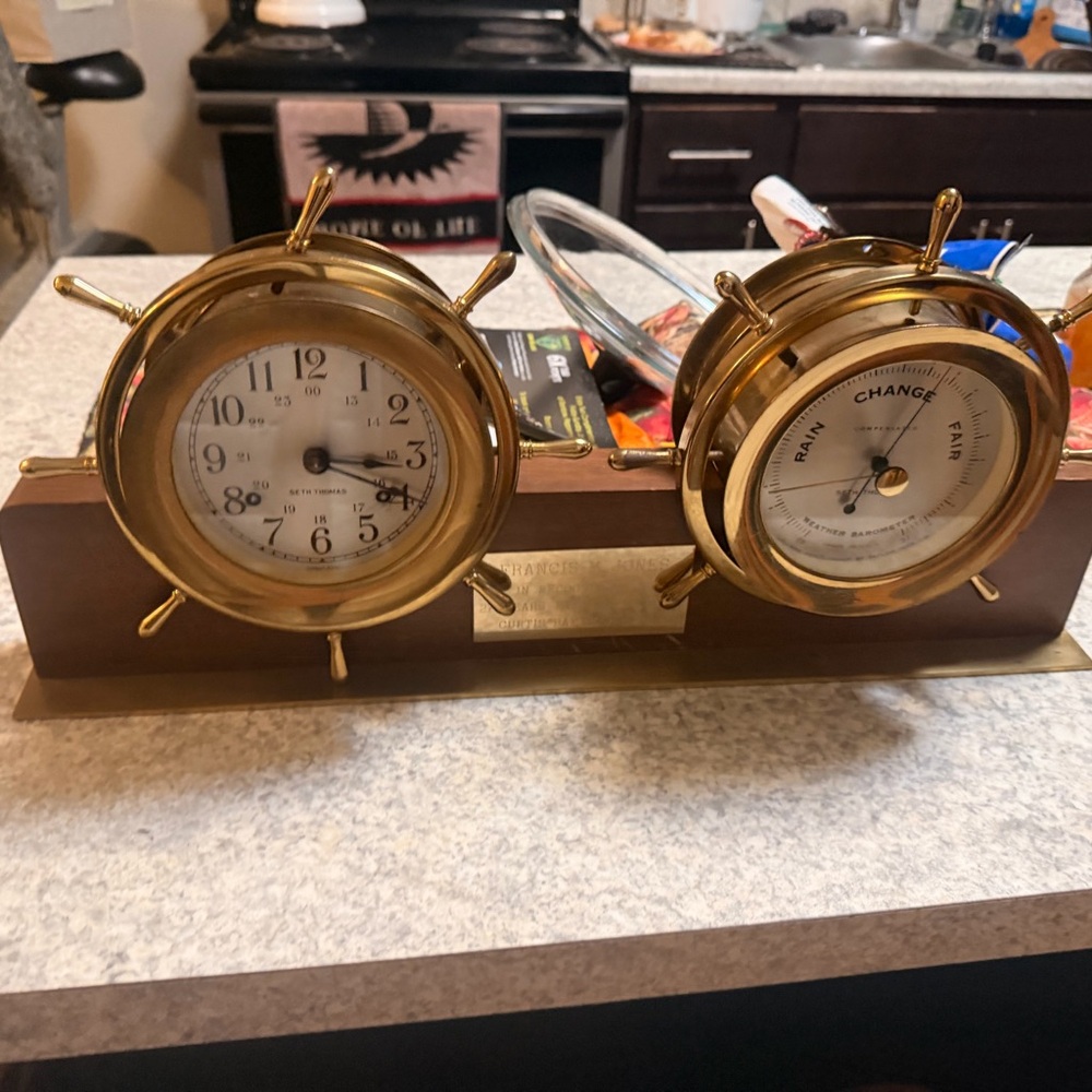SETH THOMAS AMERICAN BRASS 'HELMSMAN' SHIP'S WHEEL CLOCK AND BAROMETER, CLOCK CO